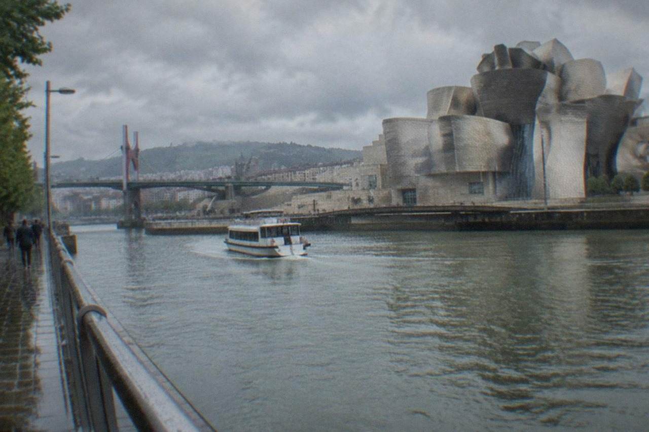 The Guggenheim Museum Bilbao beside the Nervion estuary on a bright morning