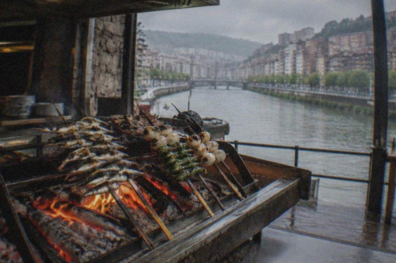 Wood-fired grill kitchen with glowing embers and skewered ingredients resting over an open hearth