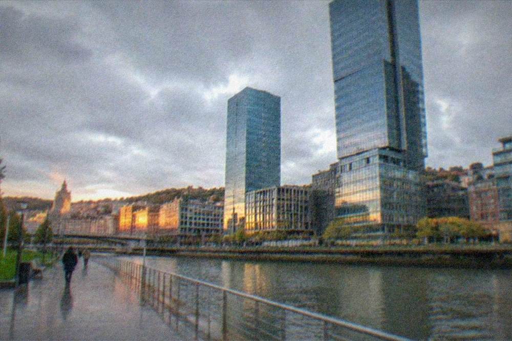 Evening light on the Gran Via buildings behind the riverfront district
