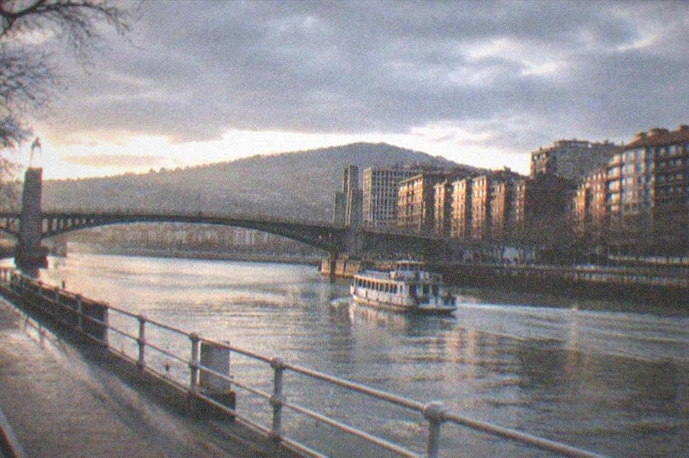 Evening light on the Deusto Bridge and apartment buildings along the Nervion river in Bilbao