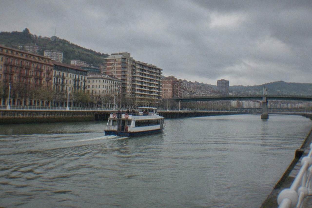 Riverside buildings and a bridge over the Nervion estuary in the San Francisco district of Bilbao
