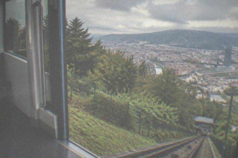 A step-free funicular carriage interior with wide doors and level floor at platform height
