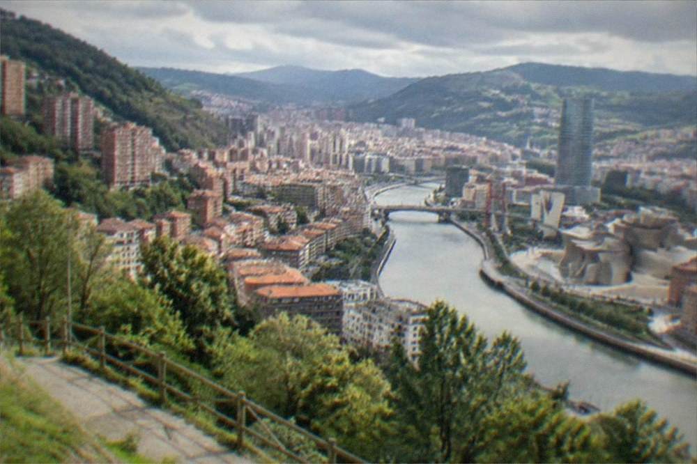 The Bilbao estuary and city skyline seen from the Mount Artxanda hillside in morning light