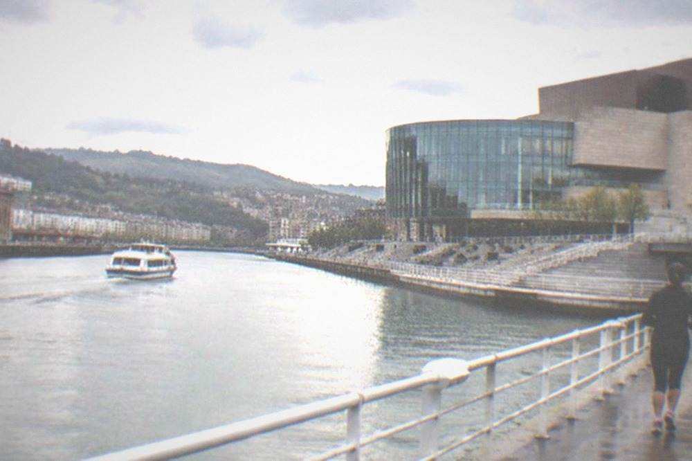 The terraces of Euskalduna Palace overlooking the Nervion estuary with boats on the water