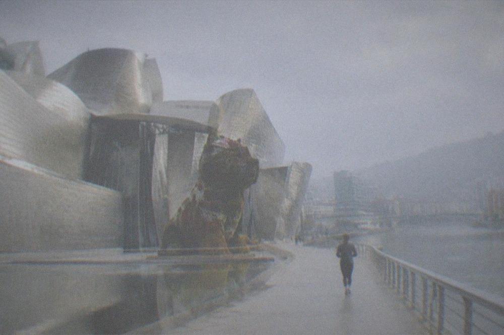 The flower-covered puppy sculpture outside the Guggenheim Museum Bilbao on the riverfront