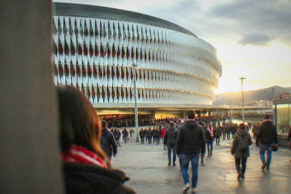 Fans walking toward the San Mames metro and intermodal station entrance on a match day in Bilbao