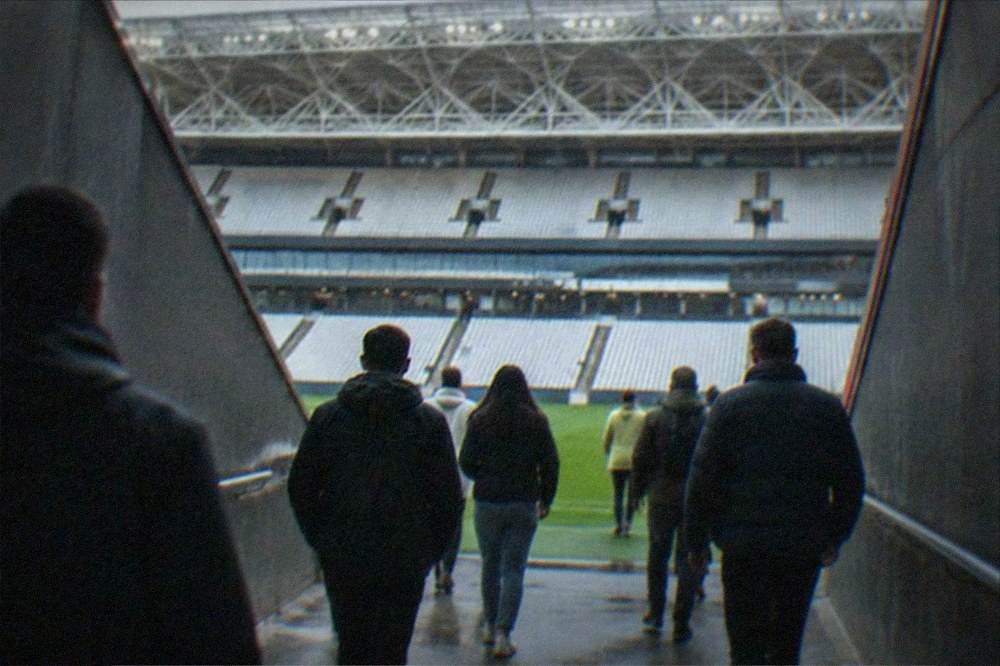Visitors walking through the players tunnel toward the pitch at San Mames Stadium in Bilbao
