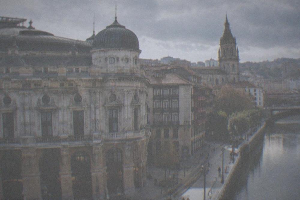 The Gothic cathedral tower rising above the narrow streets of the Old Town near the theatre
