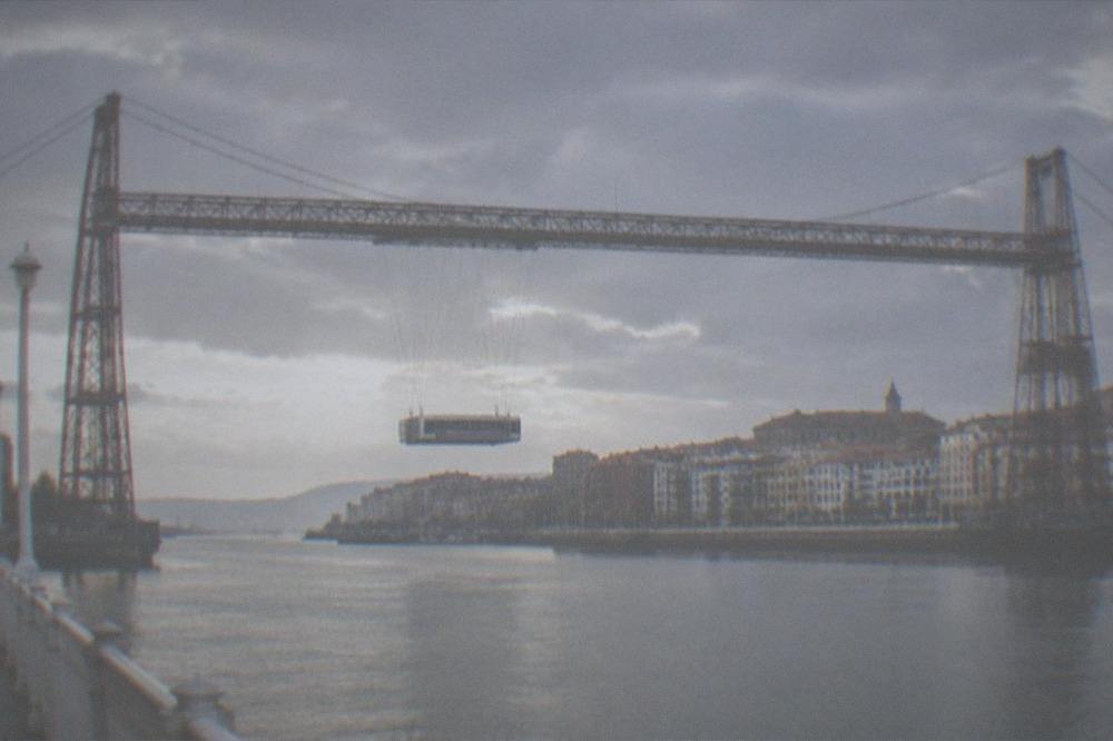 The Vizcaya Bridge seen from the Portugalete riverbank with the old town behind