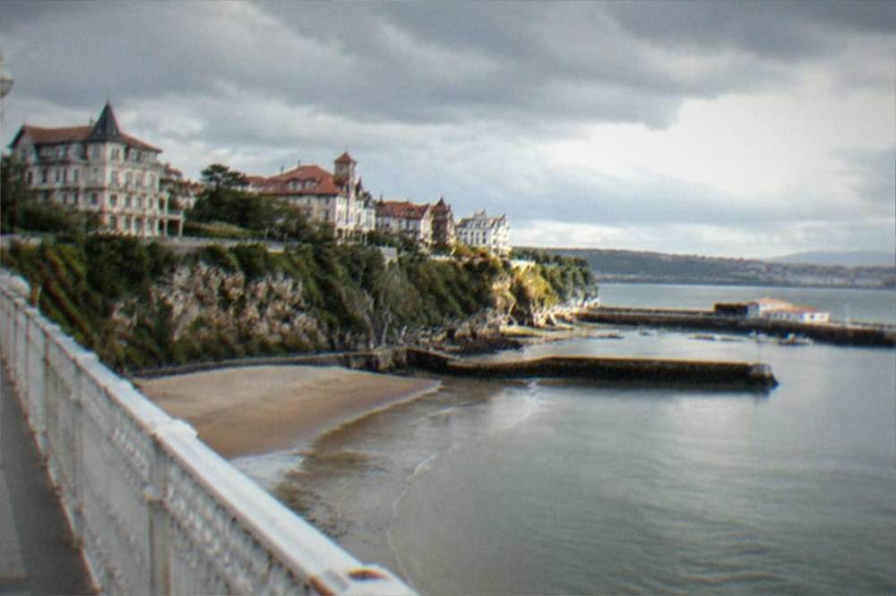 The mansion-lined cliffs of Getxo above the estuary seen from the bridge walkway