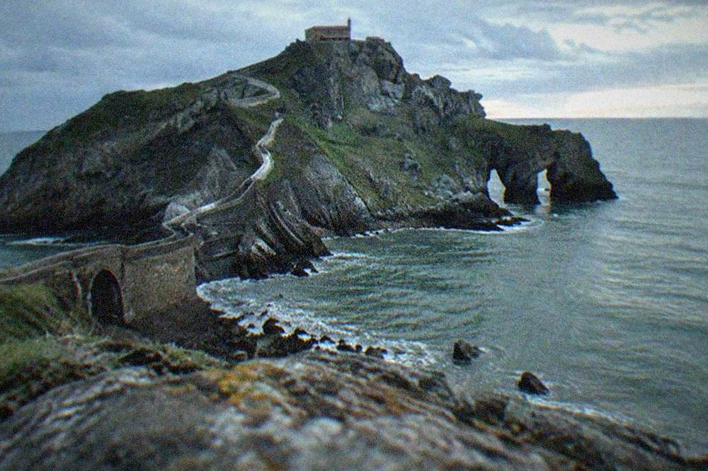 The clifftop viewing point above the causeway at San Juan de Gaztelugatxe with the Atlantic Ocean beyond
