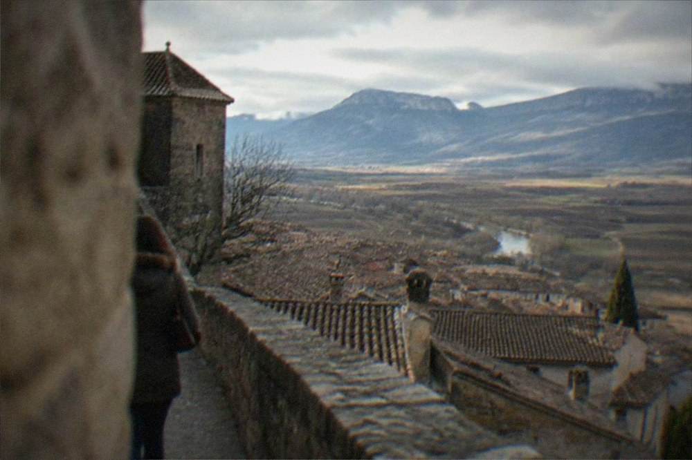 View from Laguardia's walls across red-tiled rooftops to the Sierra de Cantabria mountains