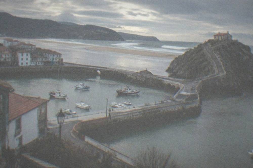 Stone causeway and long stairway leading to a hermitage on a rocky islet on the Basque coast