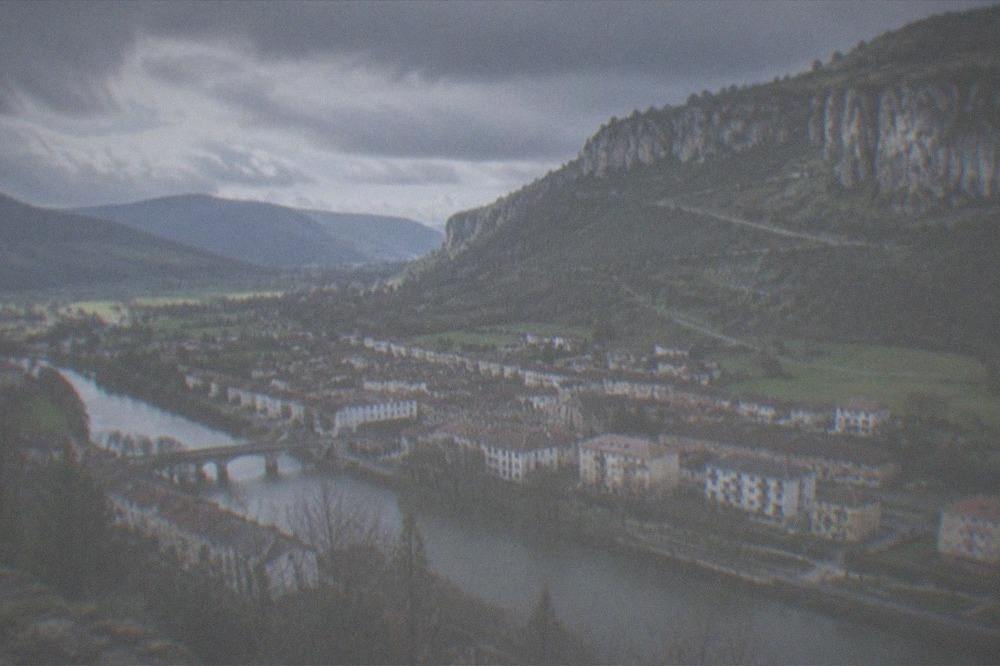 Green mountain valley under a mix of sun and rain clouds in the Basque Country