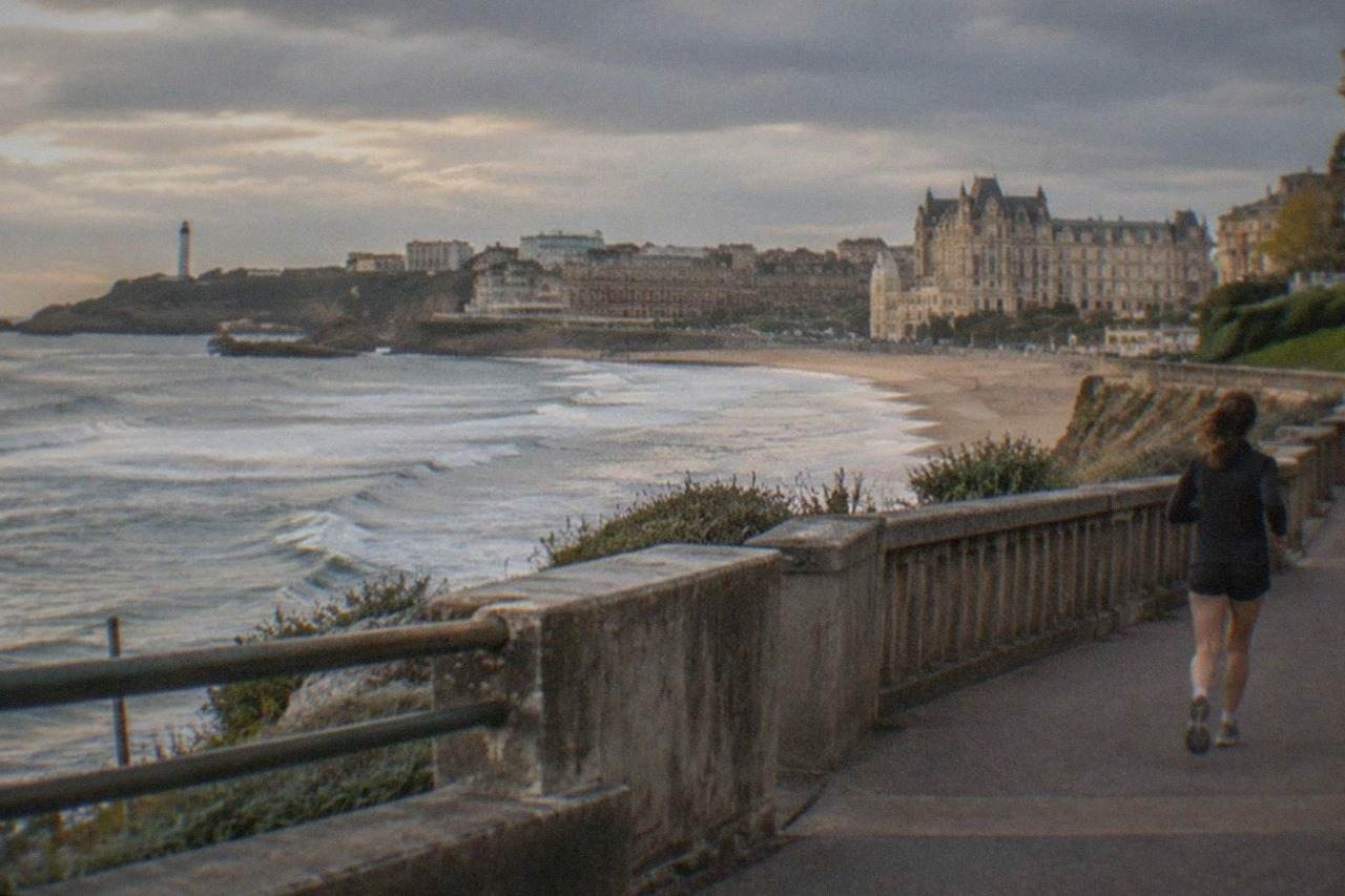 Coastal view over the Biarritz waterfront with the Atlantic ocean and a historic seaside town in the background