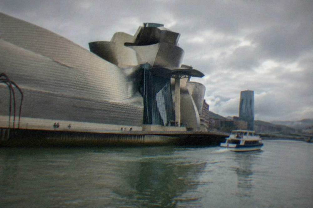 The curved titanium panels of the Guggenheim Museum beside the Nervion river in central Bilbao