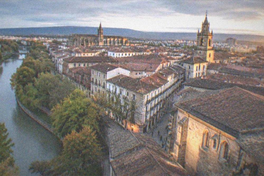Evening view of Vitoria-Gasteiz old town rooftops with warm light on stone facades
