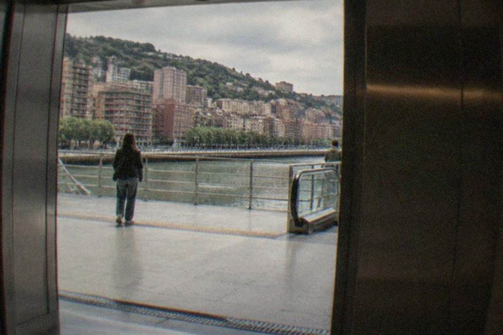 Wide elevator doors opening onto a bright metro platform in Bilbao