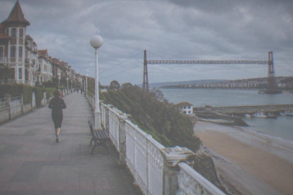 Level seaside promenade in Getxo with the Vizcaya transporter bridge visible across the estuary