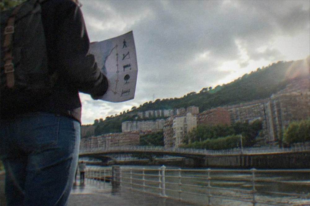 Traveller reading an accessible pictogram route map at a metro station in Bilbao