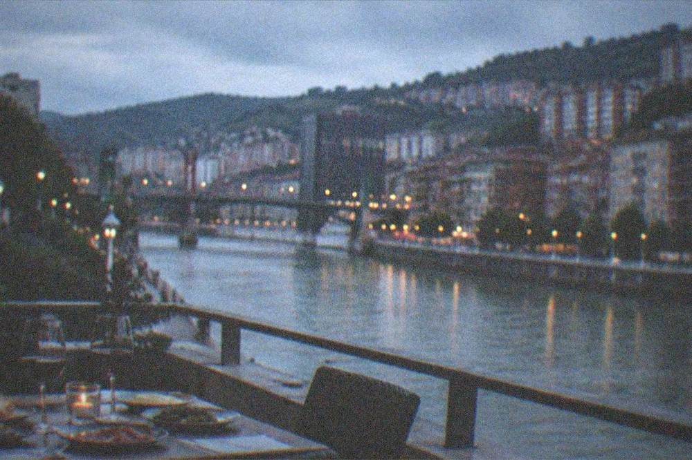 A table set with small plates of food and glasses of wine in a Bilbao restaurant