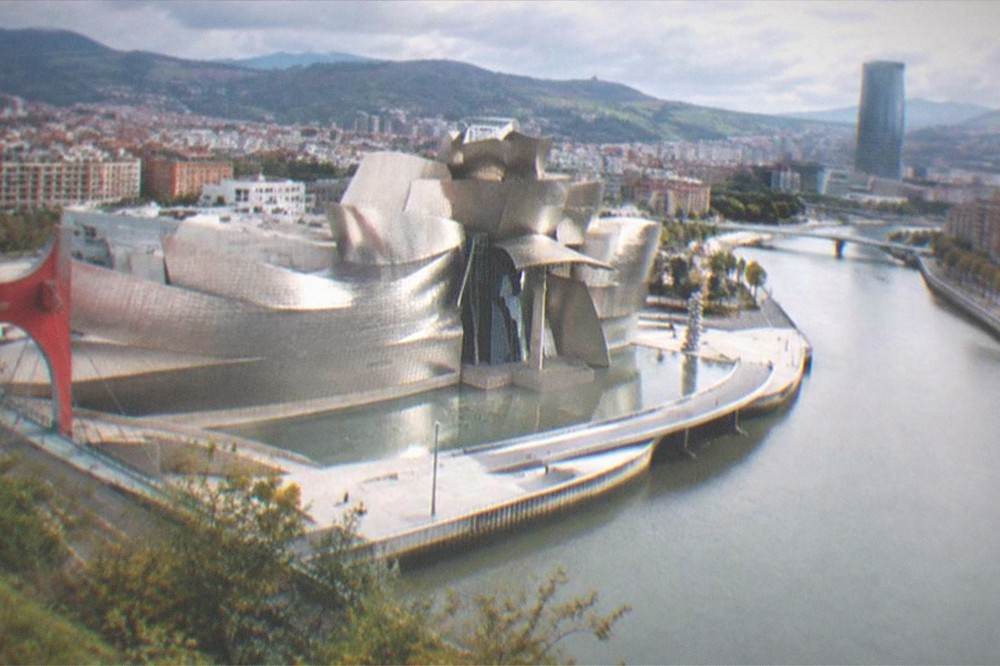 View over Bilbao's rooftops and river from a hillside viewpoint