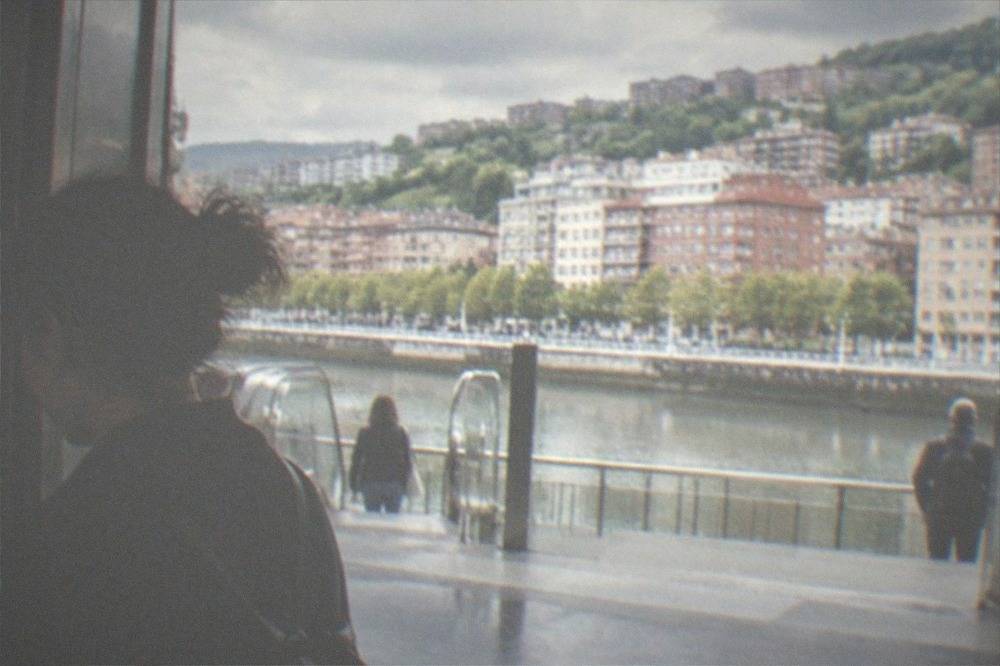 A traveller topping up a Barik transport card at a machine in a Bilbao metro station