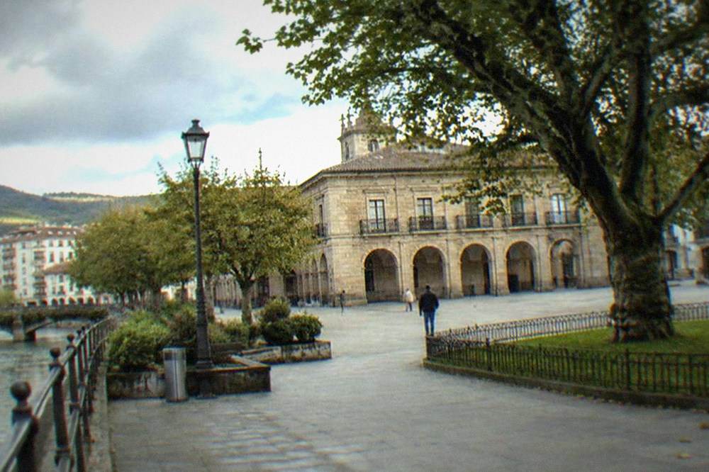 The old town of Gernika with the Assembly House and oak tree plaza in soft afternoon light