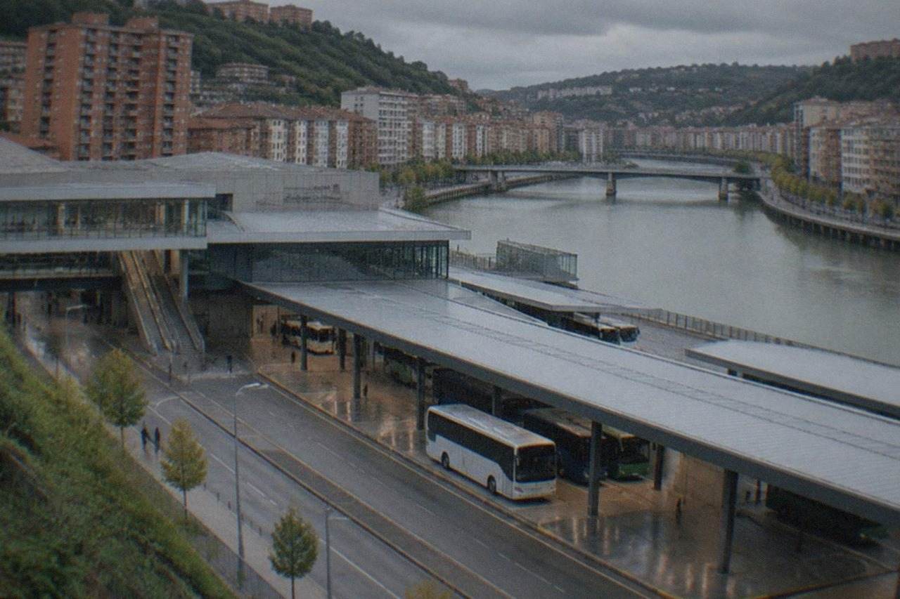 Modern bus and transport interchange building in Bilbao with buses at covered platforms