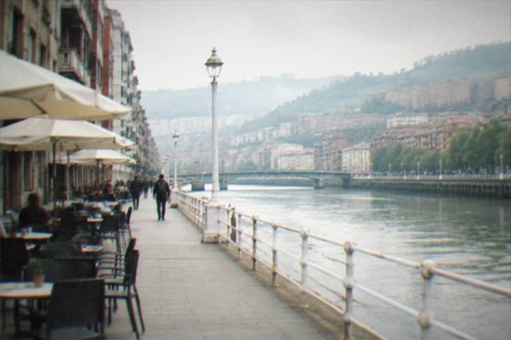 The Gran Vía in Bilbao in morning light with cafés along the sidewalk