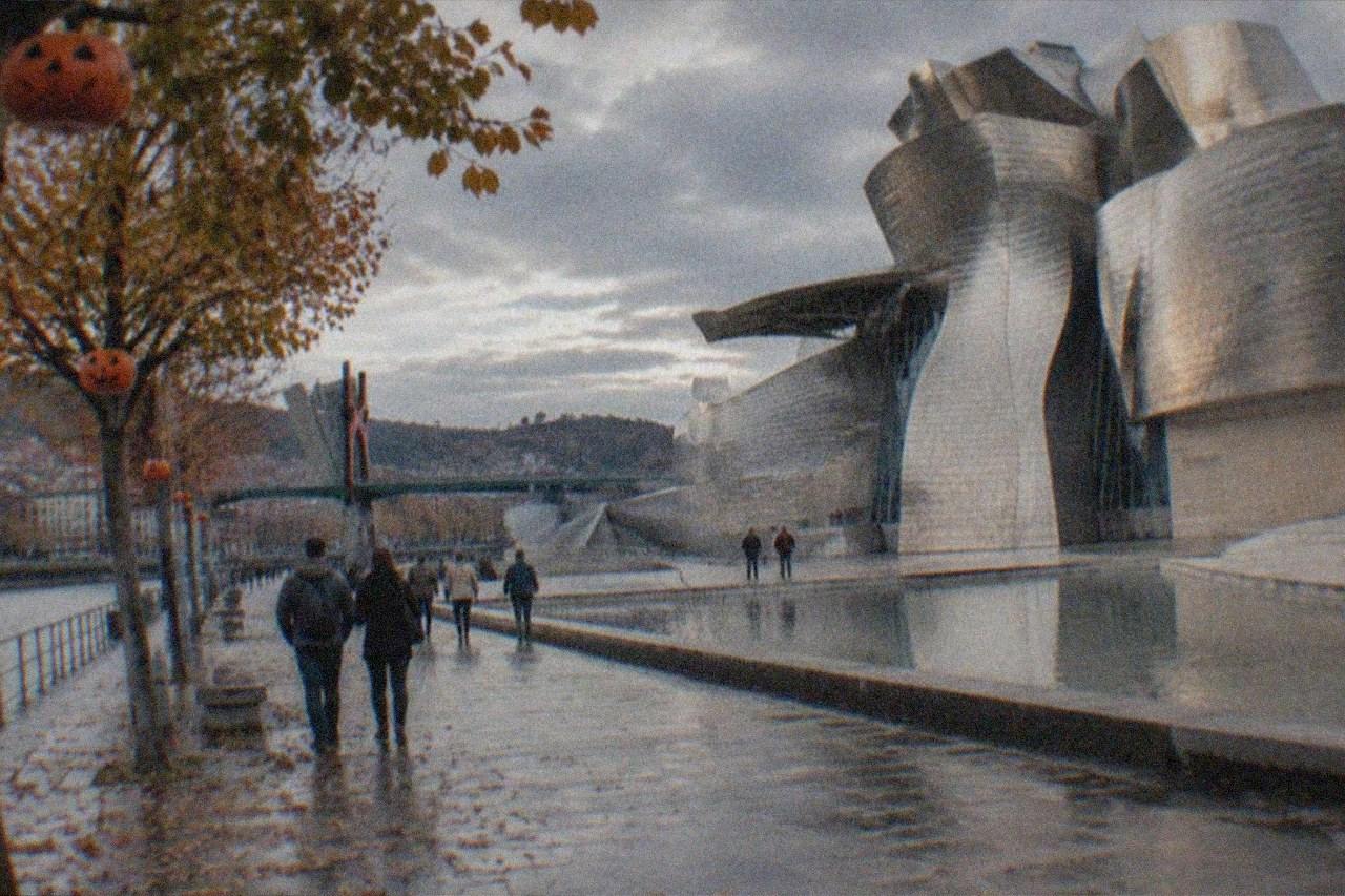 Autumn leaves and jack-o-lantern decorations along a Bilbao street near the Guggenheim Museum