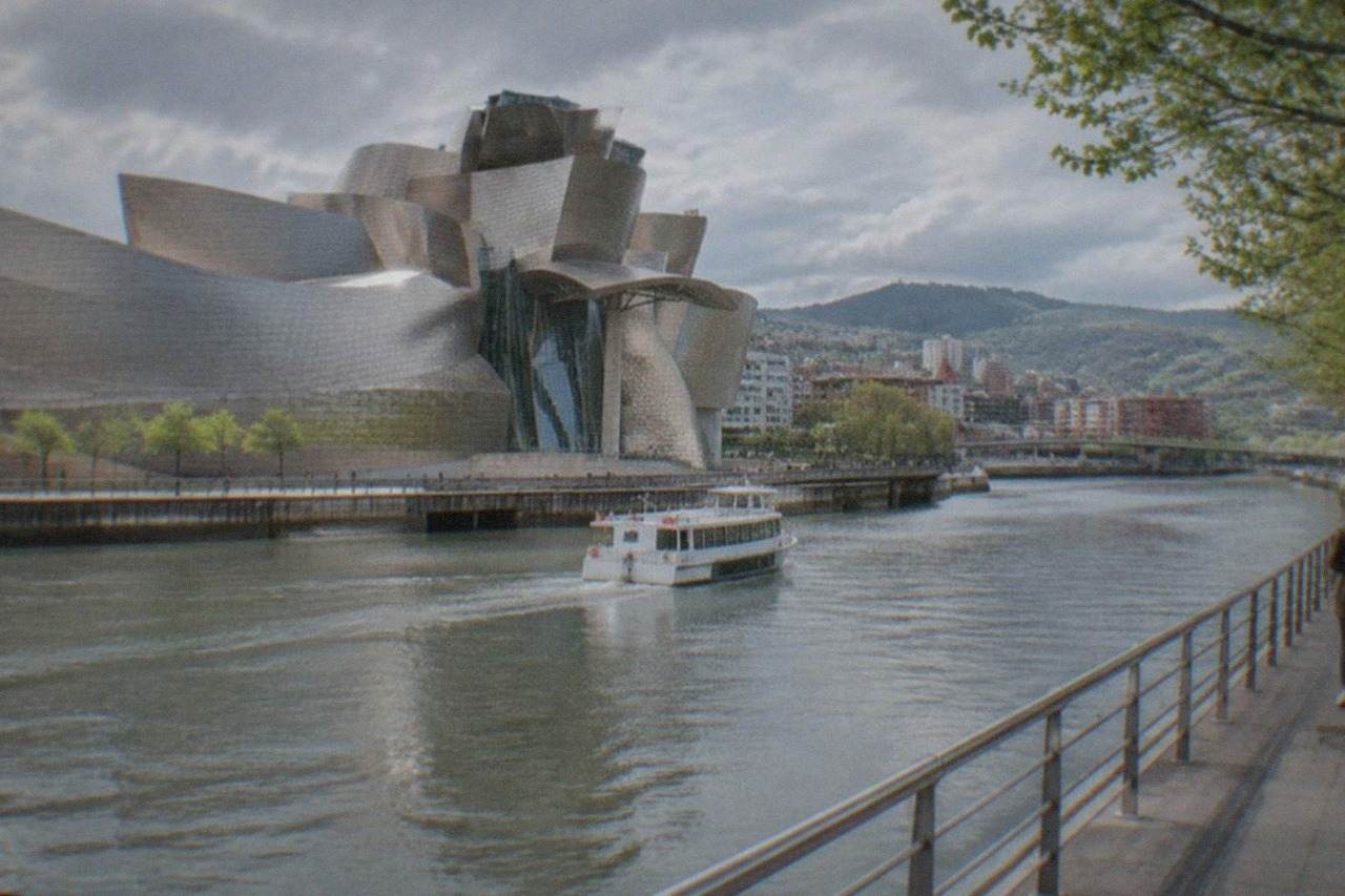 The Guggenheim Museum Bilbao beside the Nervion estuary on a mild spring day