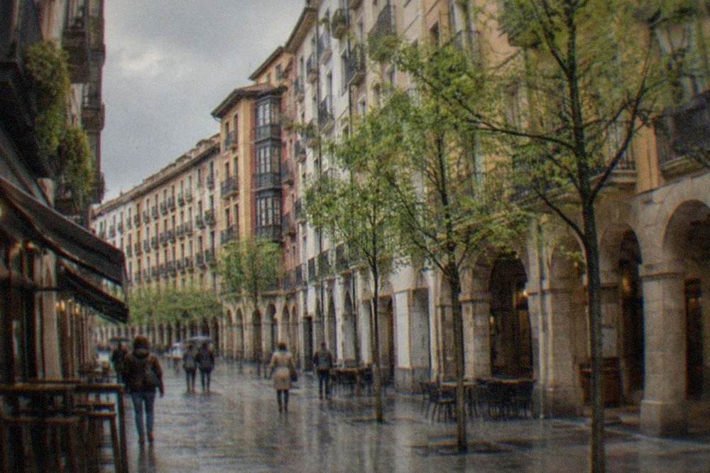 Spring rain clouds passing over the coloured facades of the Seven Streets in Bilbao's Old Town