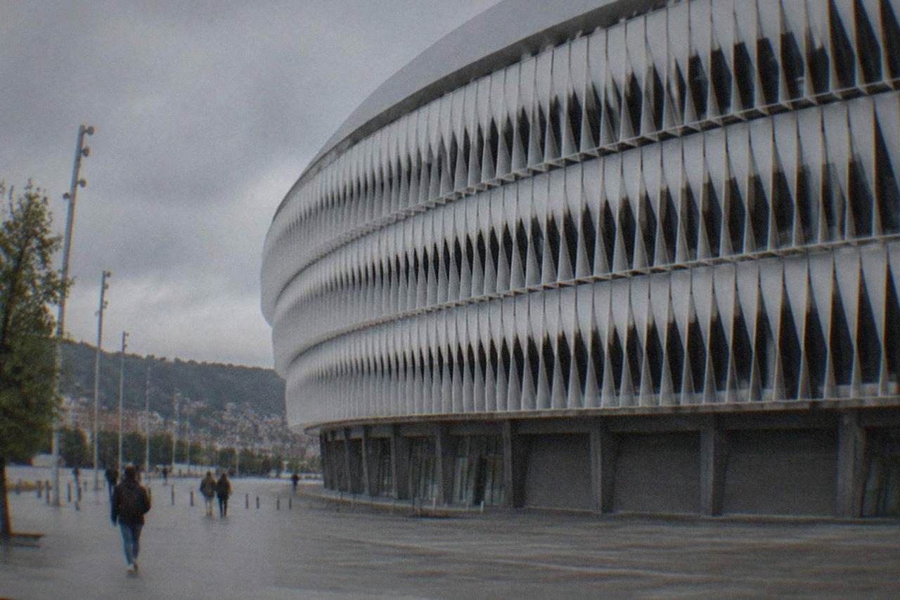 The modern facade of San Mames stadium in Bilbao under a daytime sky