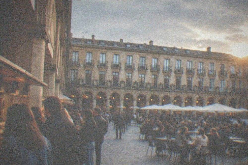 Crowded pintxos bar counters in Plaza Nueva in Bilbao's Old Town on a weekday evening