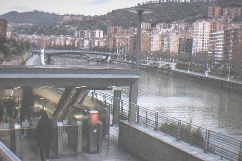 A Bilbao metro station entrance with a Barik card reader beside the gates