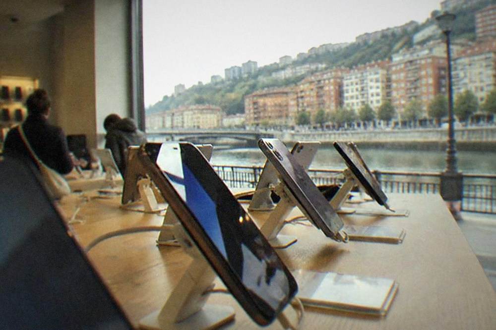A shop interior with smartphones displayed on a counter