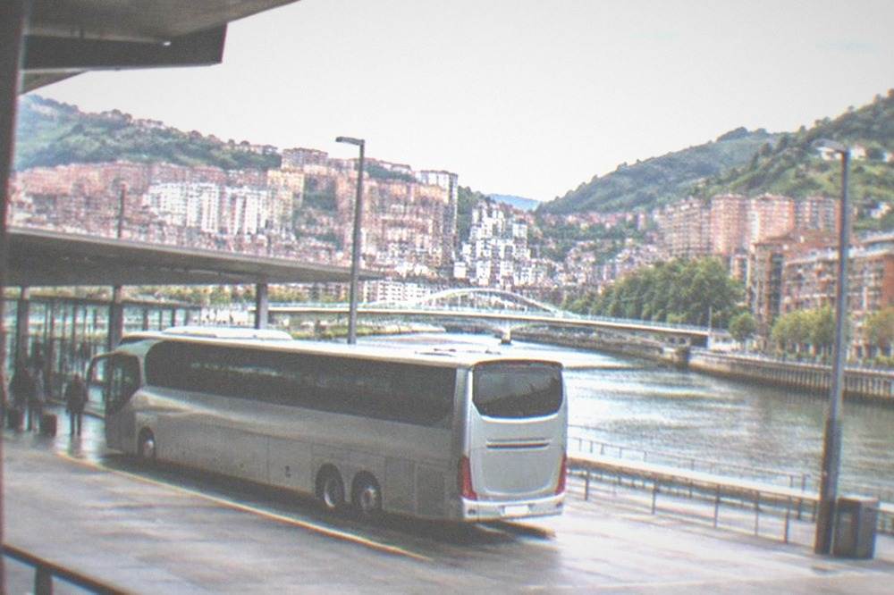 A long-distance bus parked at the modern Bilbao Intermodal transport station