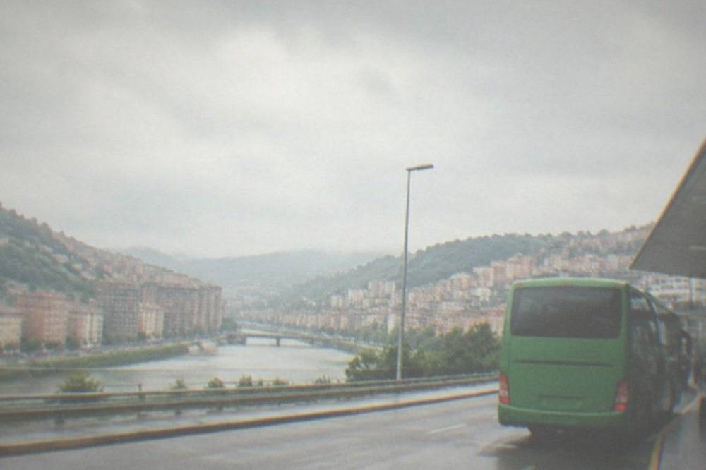 The Bizkaibus airport bus waiting at a kerb outside Bilbao Airport terminal