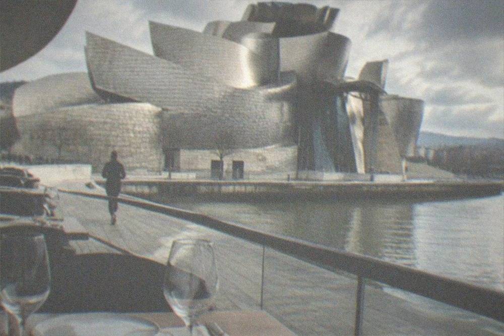 A set table with wine glasses at a modern Bilbao restaurant near the Guggenheim Museum