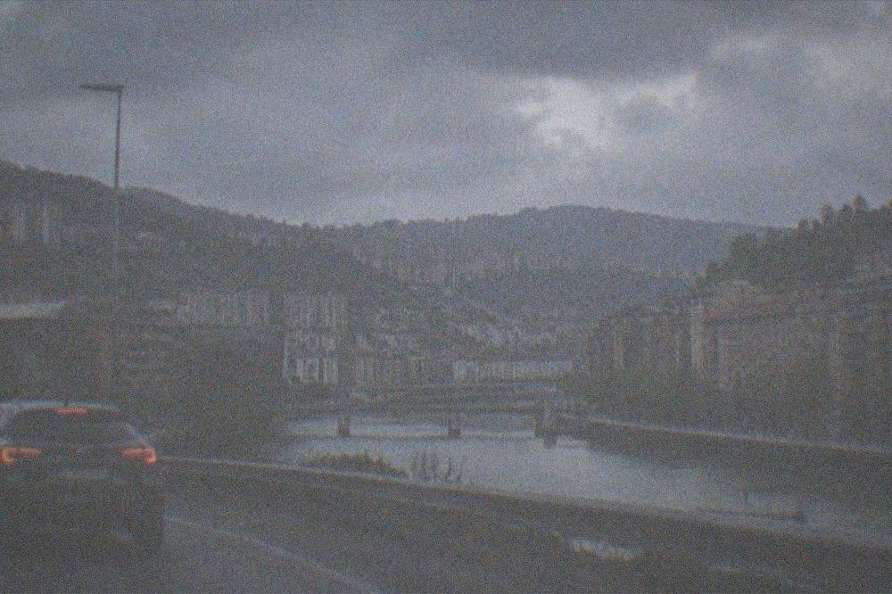 A car merging onto a motorway outside Bilbao on an overcast day