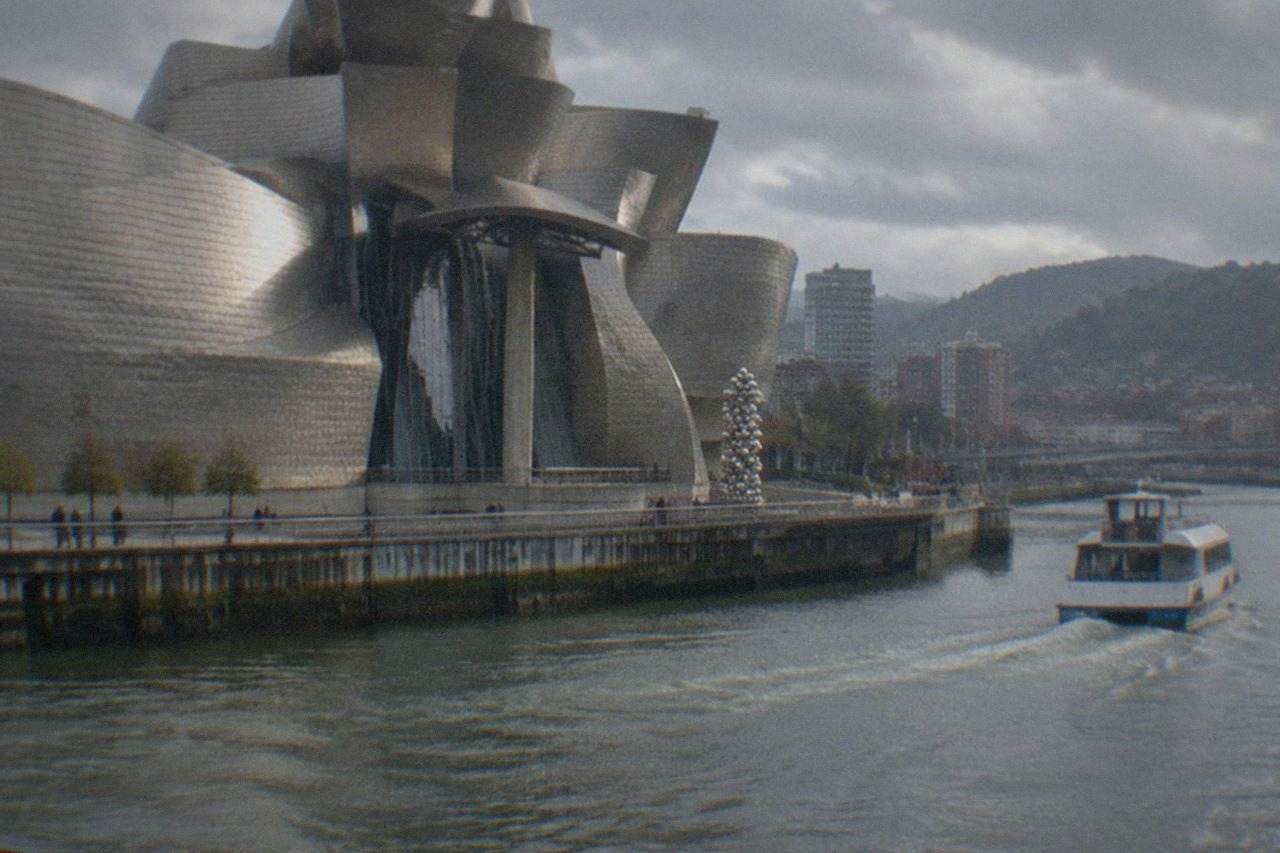 The Guggenheim Museum Bilbao beside the Nervion estuary on a bright morning