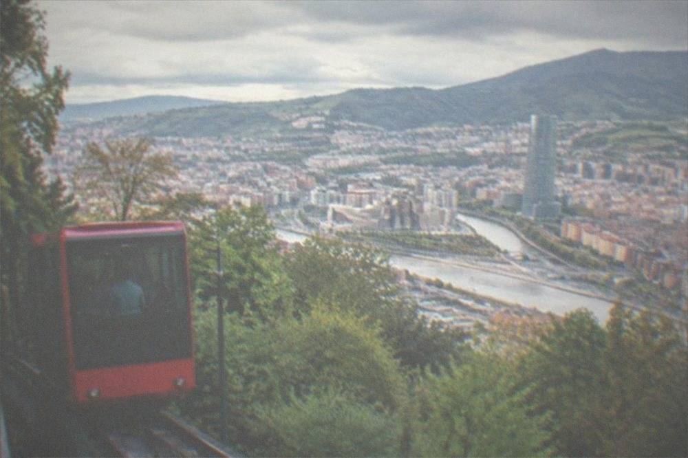 The Artxanda funicular carriage climbing the hillside above Bilbao's rooftops