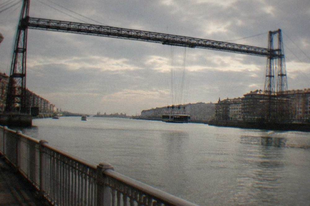 The transporter bridge at Portugalete crossing the Bilbao estuary with a ferry gondola suspended beneath it