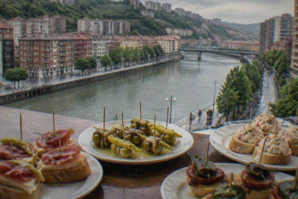 Close view of pintxos arranged on a bar counter with toothpicks