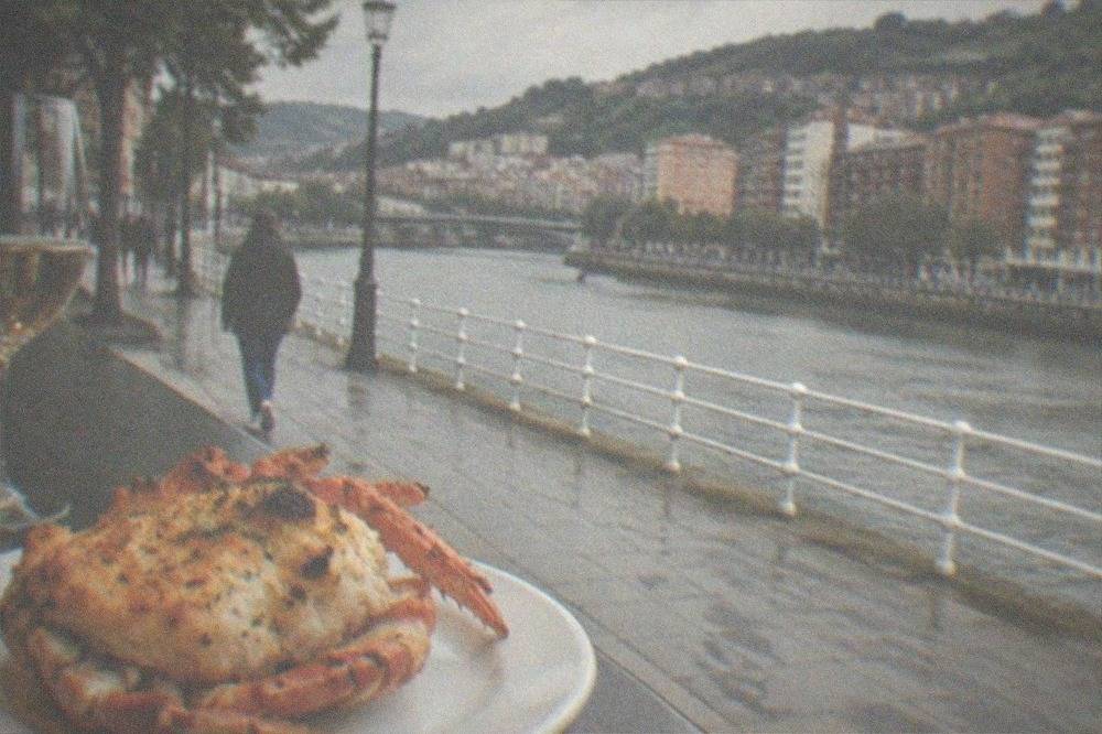 Gratinated spider crab pintxo served at a bar counter in Bilbao