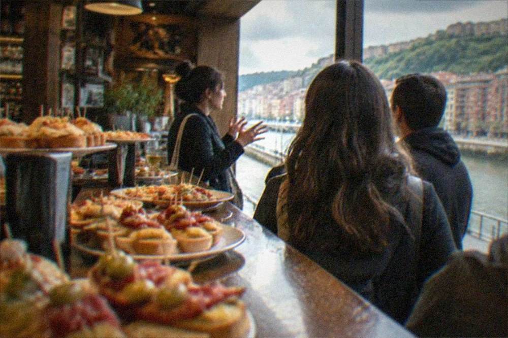 A local guide leading a small group through a Bilbao pintxos bar
