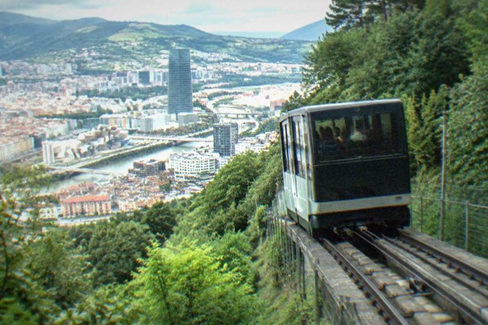 The Artxanda funicular car climbing the wooded hillside above central Bilbao