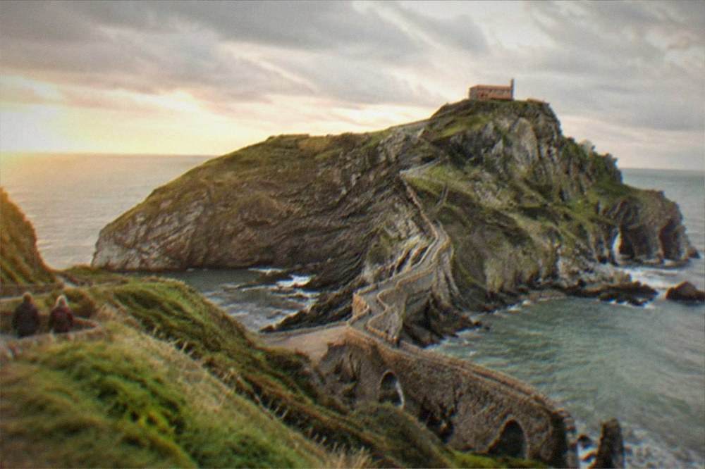 The rocky islet of San Juan de Gaztelugatxe with its stone bridge and steps rising from the Basque coast