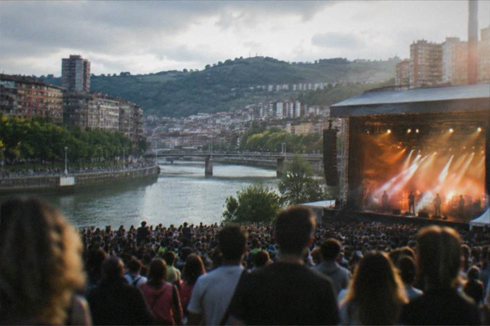 Crowds and concert lighting during the Aste Nagusia festival in central Bilbao
